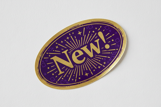 Exciting purple and gold sticker that says New!